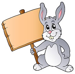 Image showing Cute bunny holding wooden board