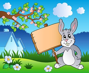 Image showing Meadow with bunny holding board