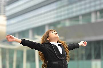 Image showing business woman stretch oneself