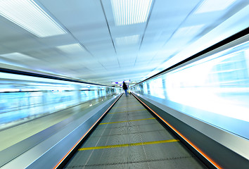 Image showing moving escalator with person