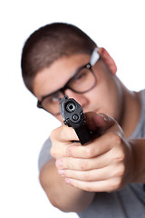 Image showing Teenage Guy Pointing a Gun