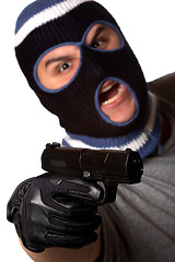 Image showing Masked Criminal Points a Gun