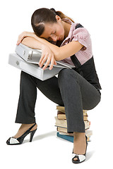 Image showing young girl asleep sitting on the books