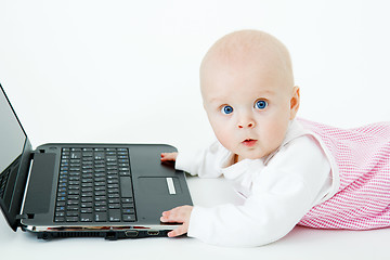 Image showing baby with laptop in studio