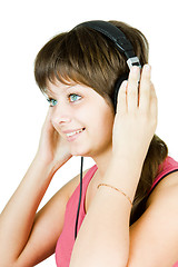 Image showing beautiful girl in headphones listens to music
