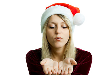 Image showing portrait of a beautiful blonde in a Christmas hat on the isolate