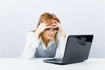 Image showing weary worker in the office