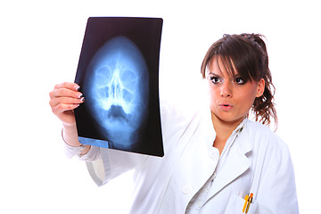 Image showing Female doctor looking at an x-ray