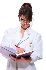 Image showing Female doctor holding a notebook