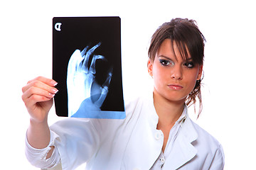 Image showing Female doctor looking at an x-ray