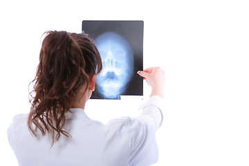 Image showing Female doctor looking at an x-ray