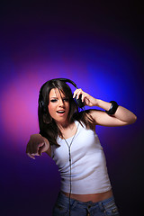 Image showing girl enjoys music