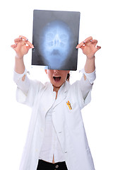 Image showing Female doctor looking at an x-ray