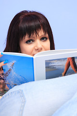 Image showing beautiful young woman reading