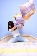 Image showing Woman having pillow fight