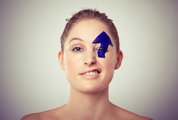 Image showing arrow painted over eye