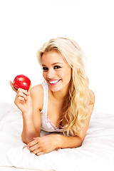 Image showing blonde with apple 