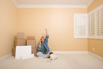 Image showing Excited Woman on Phone Near Boxes and Blank Signs