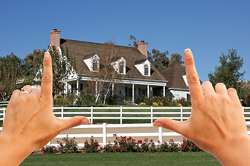 Image showing Female Hands Framing Beautiful House