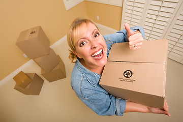 Image showing Happy Thumbs Up Woman Moving Boxes