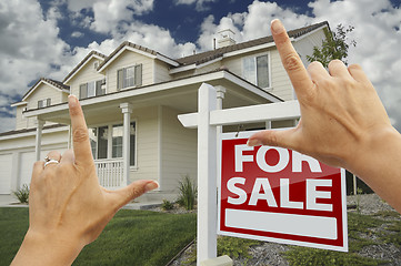 Image showing Hands Framing For Sale Real Estate Sign and New House
