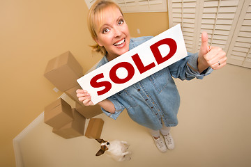 Image showing Woman and Doggy with Sold Sign Near Moving Boxes