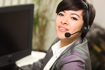 Image showing Attractive Young Mixed Race Woman Smiles Wearing Headset