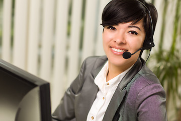 Image showing Attractive Young Woman Smiles Wearing Headset