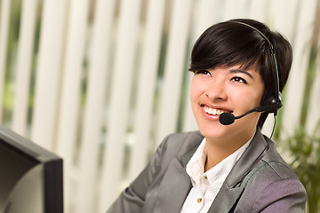 Image showing Attractive Young Woman Smiles Wearing Headset