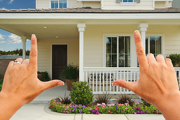 Image showing Female Hands Framing Beautiful House