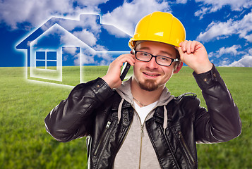 Image showing Contractor in Hard Hat in Front of Ghosted House and Grass Field