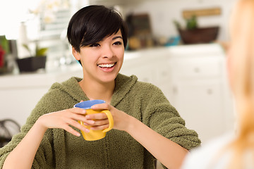 Image showing Multi-ethnic Young Attractive Woman Socializing with Friend