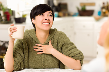 Image showing Multi-ethnic Young Attractive Woman Socializing with Friend