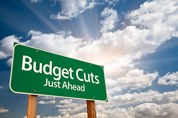 Image showing Budget Cuts Green Road Sign and Clouds