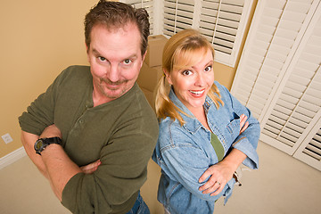 Image showing Goofy Couple and Moving Boxes in Empty Room