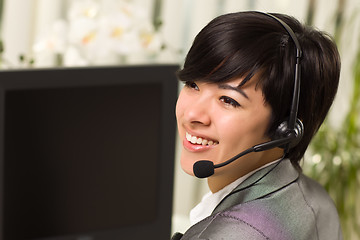 Image showing Attractive Young Woman Smiles Wearing Headset