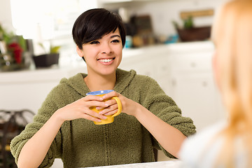 Image showing Multi-ethnic Young Attractive Woman Socializing with Friend