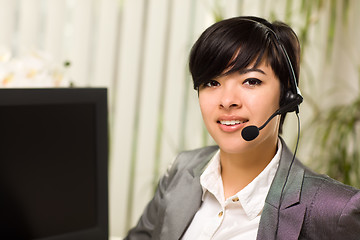 Image showing Attractive Young Woman Smiles Wearing Headset