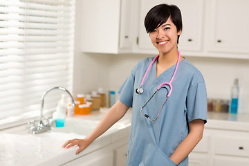 Image showing Smiling Attractive Mixed Race Doctor or Nurse in An Office