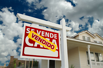 Image showing Vendido Se Vende Casa Spanish Real Estate Sign and House