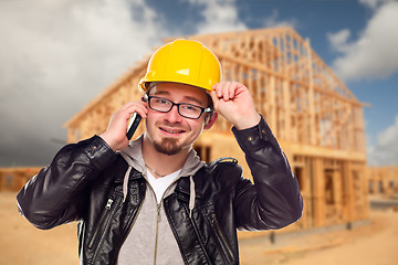 Image showing Young Cunstruction Worker on Cell Phone In Front of House