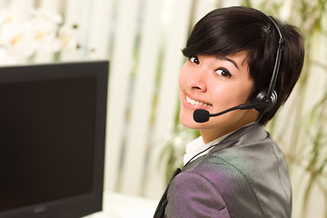 Image showing Attractive Young Woman Smiles Wearing Headset