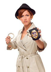 Image showing Red Haired Female Detective With Handcuffs and Badge In Trenchco