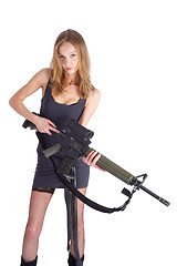 Image showing Woman with gun on white