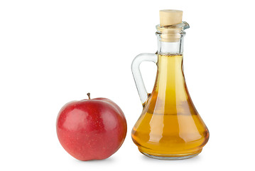 Image showing Decanter with apple vinegar and red apple