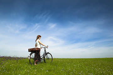 Image showing Girl with a bicycle