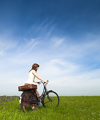 Image showing Girl with a bicycle