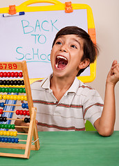 Image showing Boy with abacus screaming loudly