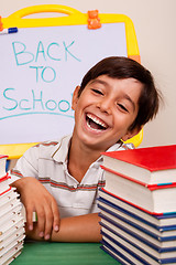 Image showing Smiling boy with school books