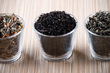 Image showing three kinds of dry tea in glasses 